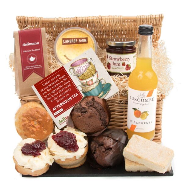 A gift basket containing assorted gourmet foods, including scones, Muffin Afternoon Cream Tea, strawberry jam, juice, and afternoon tea, all arranged neatly against a white background.