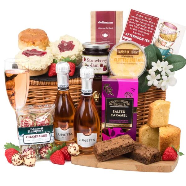 A Luxury Tea For Two with Rose Prosecco gift basket featuring a variety of snacks and desserts.