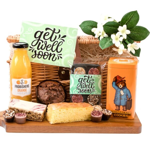 a selection of baked goods with a paddinton tin full of marmalade biscuits, some get well chocolates and a choice of drink from tea, coffee or orange juice