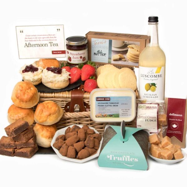 A gift basket featuring The Family Cream Tea and an assortment of treats.