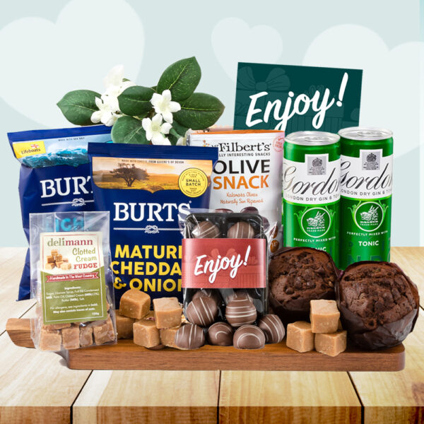 This wonderful little Gin & Tonic Summer Picnic hamper is perfect for an indulgent treat! Ideal for a summer picnic, a movie night, a get well soon gift, to say thank you or just to share with someone special! Tuck into rich chocolate muffins with marc de champagne truffles and clotted cream fudge. Or sample some savoury delights with lemon & oregano olives and Devonshire crisps! Finished of with a refreshing drink of Gordon's Gin & Tonic.