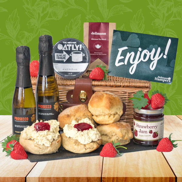 Treat yourself to the Vegan Prosecco Cream Tea Gift: a hamper with vegan scones, plant based oat cream, strawberry jam, tea, and two bottles of Vegan Prosecco.
